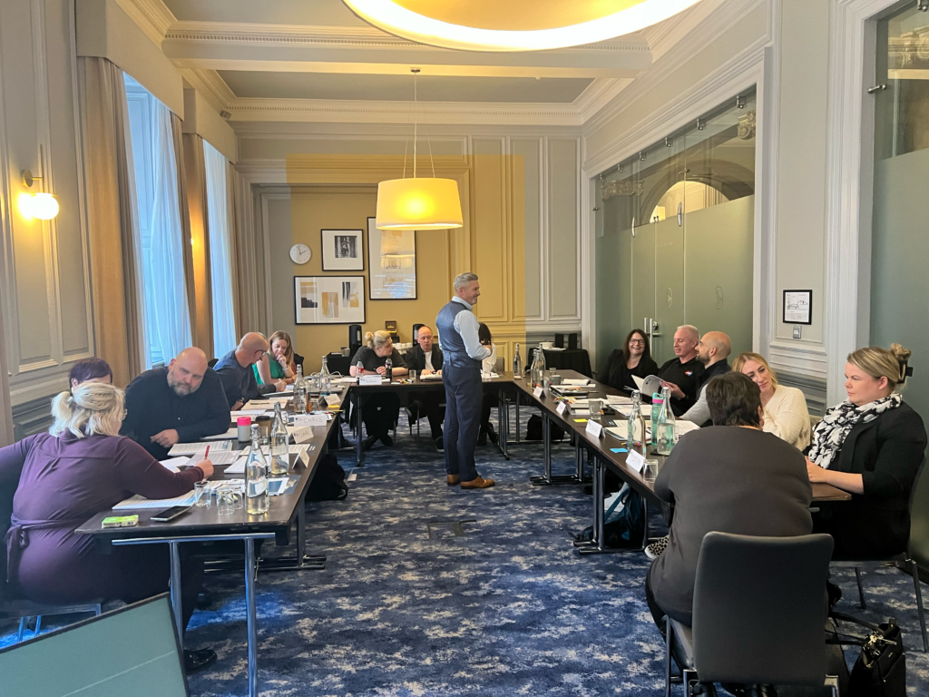 James delivering in person change management training in a board room