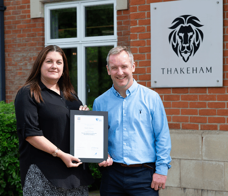 Thakeham Graduate and trainer Alan posing with a Managing with Motivational Intelligence certificate.