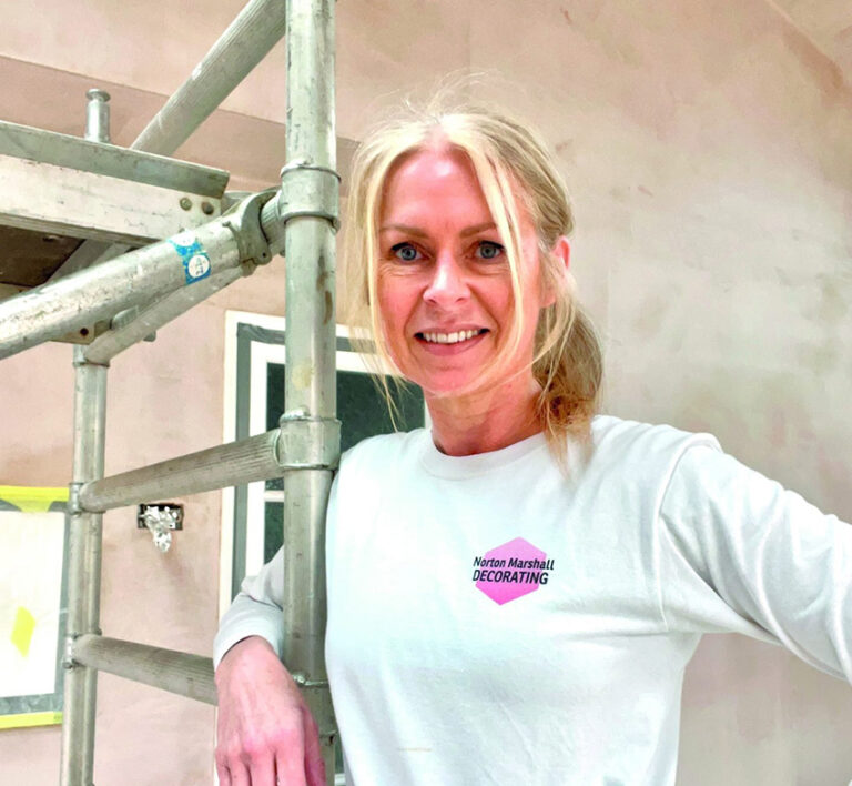 Sharon Norton smiling confidently as she reflects on her Women in Leadership experience and entrepreneurial success.